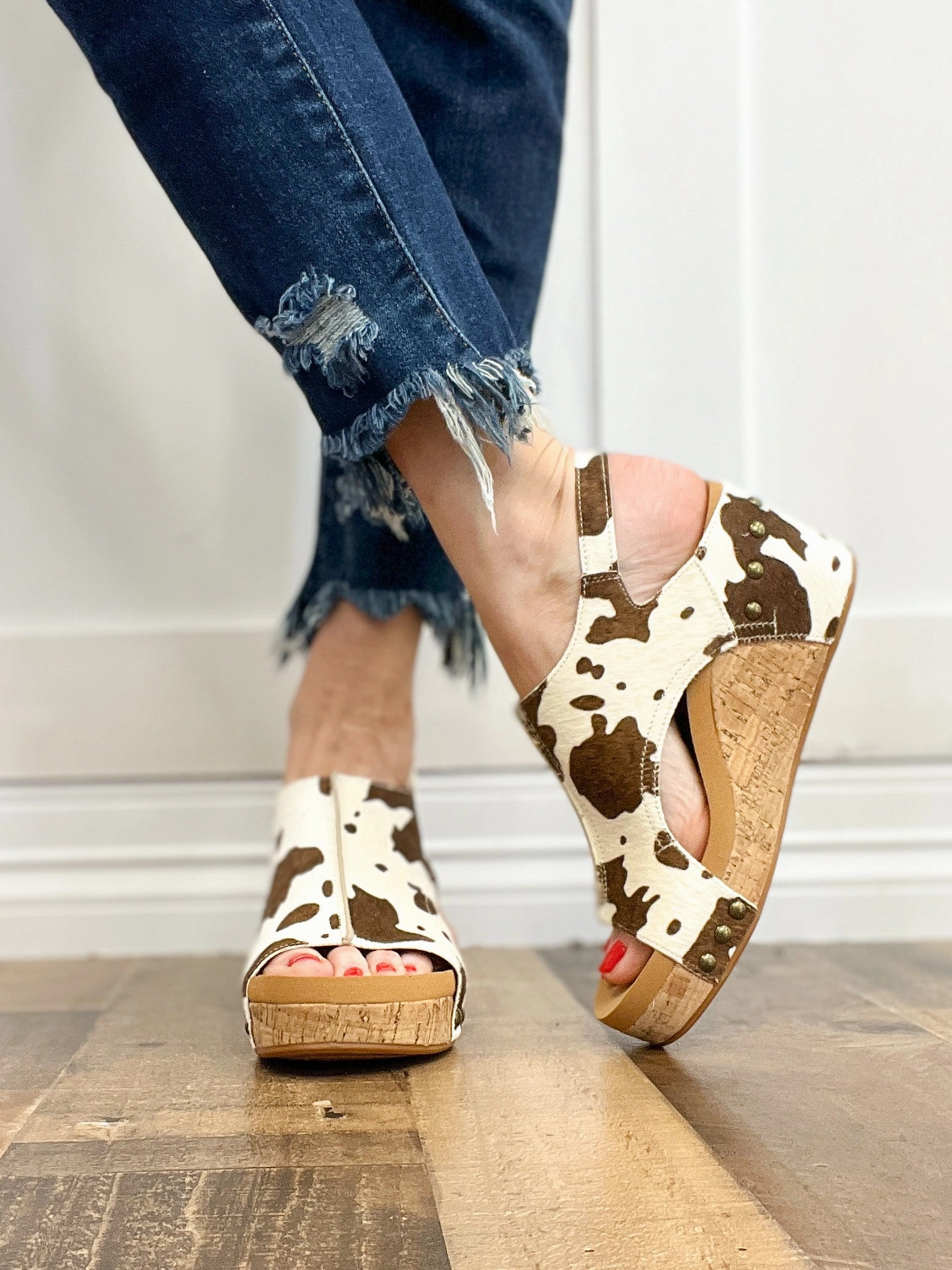 Corkys Pasture Wedge Sandals in Cow Print